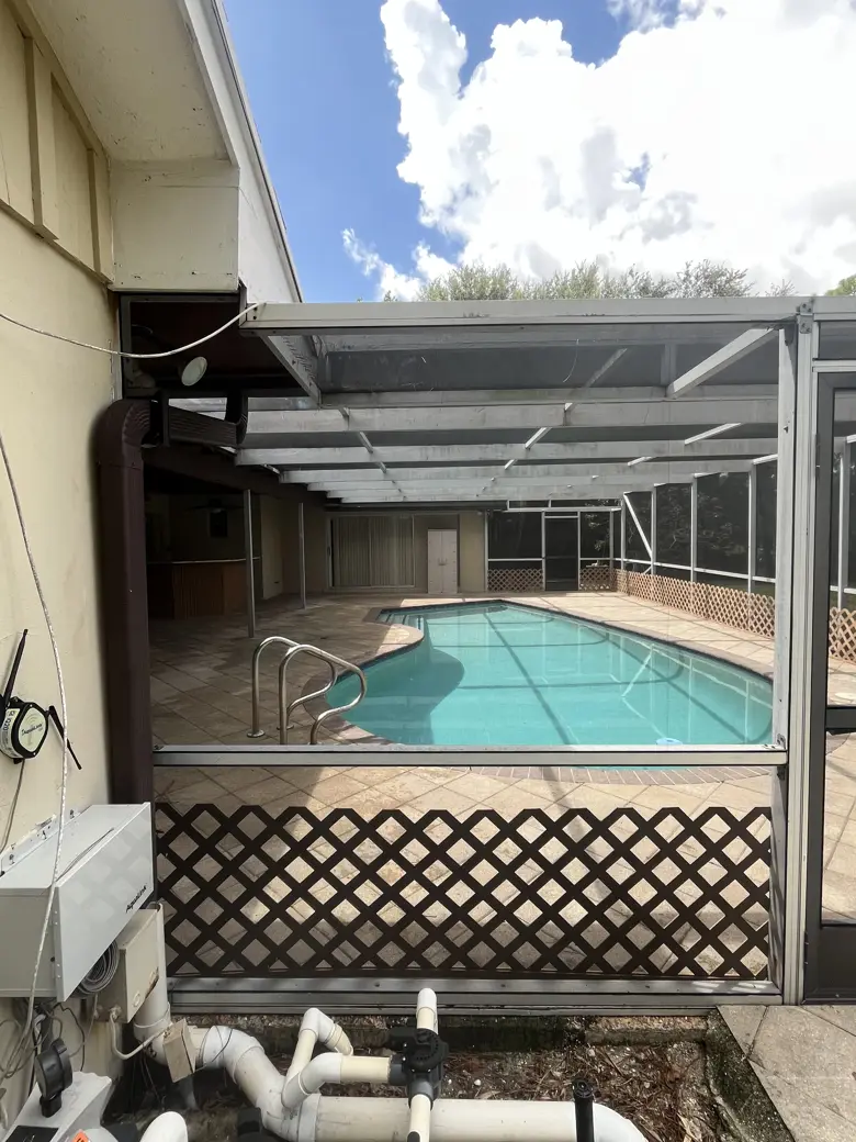 After: the pool cage corner rescreened and squared away