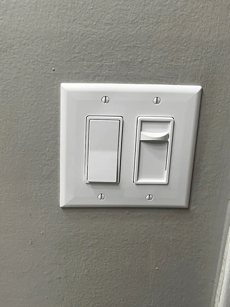 After: new white rocker switch and dimmer, set flush and level