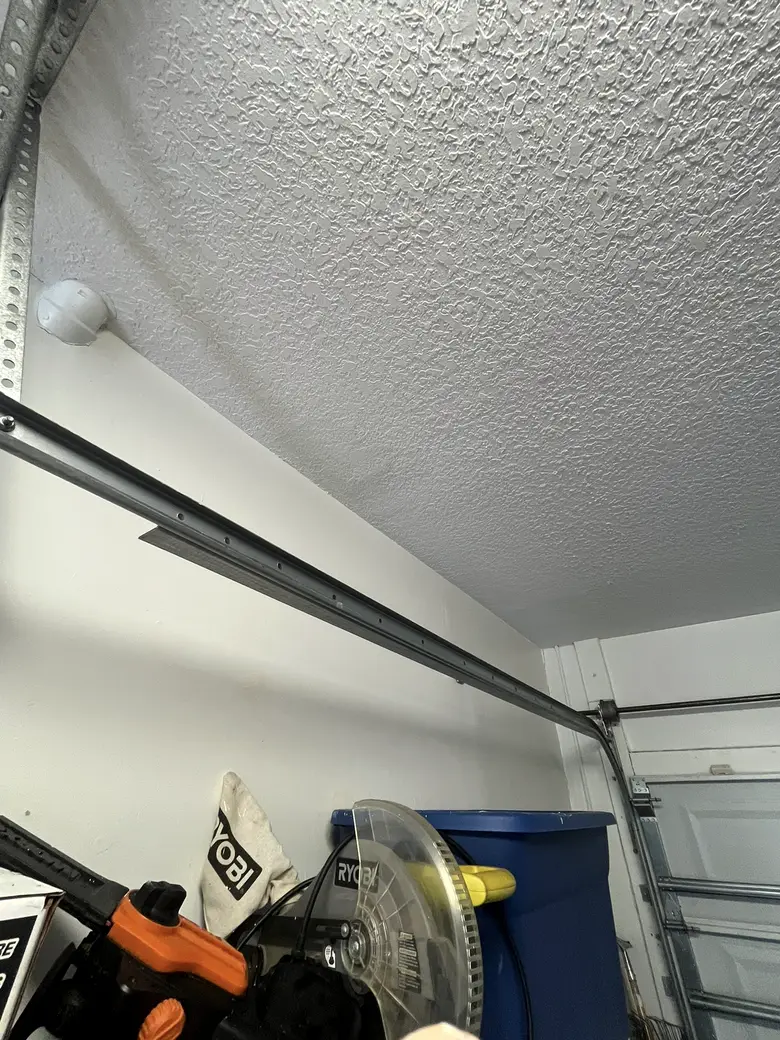 A freshly textured and painted garage ceiling