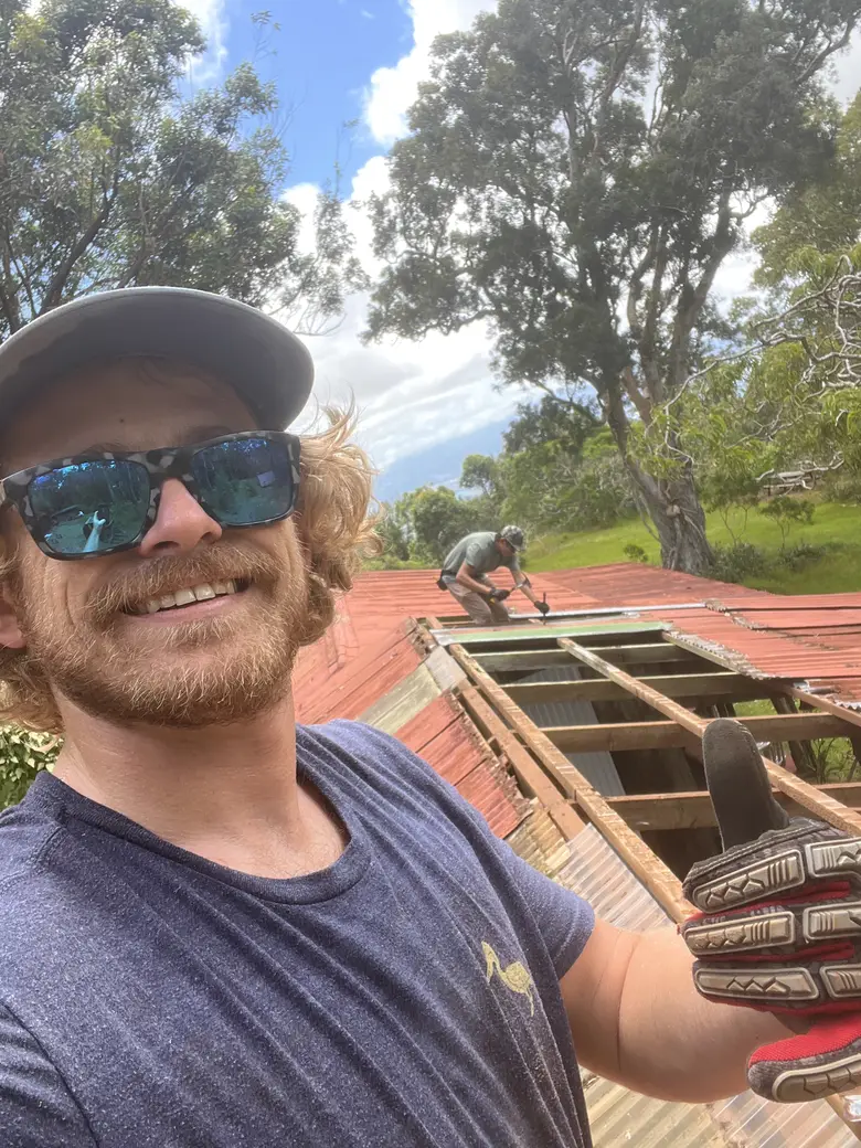 Nick on the job, grinning, gloves on